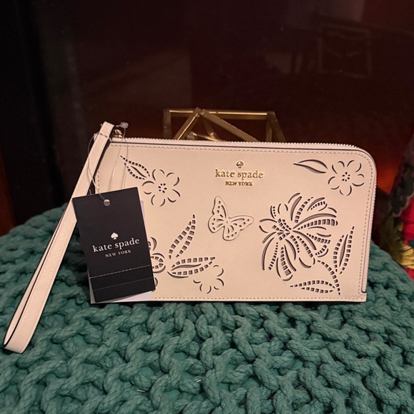 kate spade Handbags - Kate Spade White Floral Cutout Wristlet